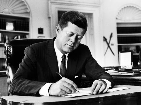 Kennedy at his desk