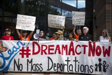 Supports of the Dream Act holding a Banner