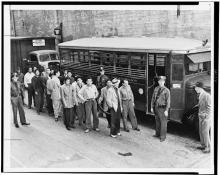 Young Mexican men stand outside a jail in Los Angeles, California, after police arrested them during the 1943 Zoot Suit Riots.